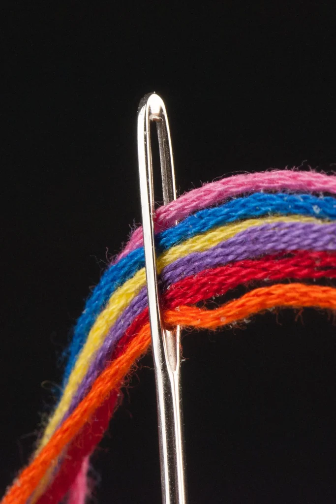 Close-up image of embroidery thread conditioner in needles