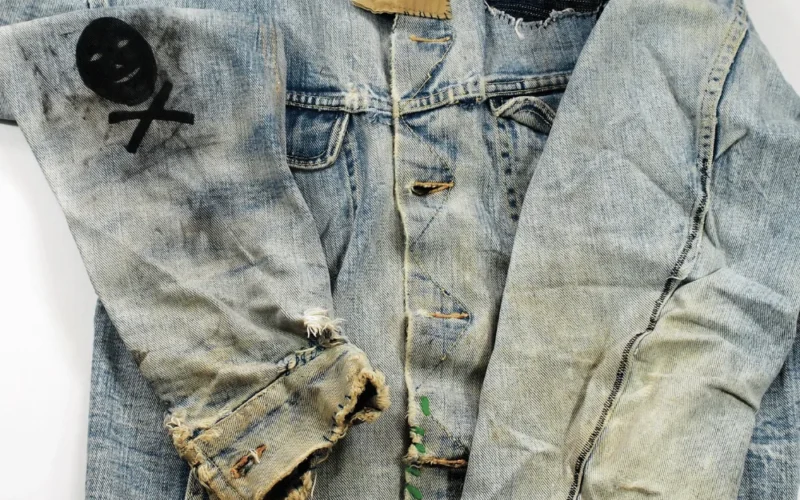 image of a jean jacket with patchwork on it