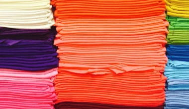 pile of rainbow t shirts heat press vs screen print