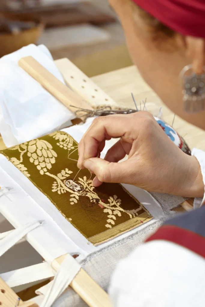 woman hand embroidering pattern